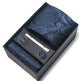 Blue paisley tie set with tie clip and cufflinks in a black box on a white background