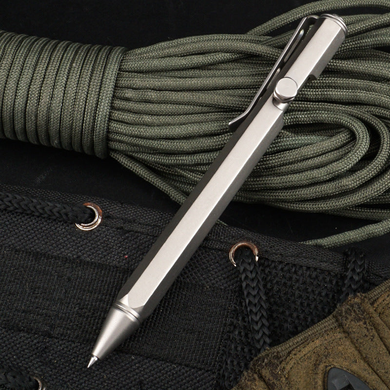 Silver pen with green rope on a black background