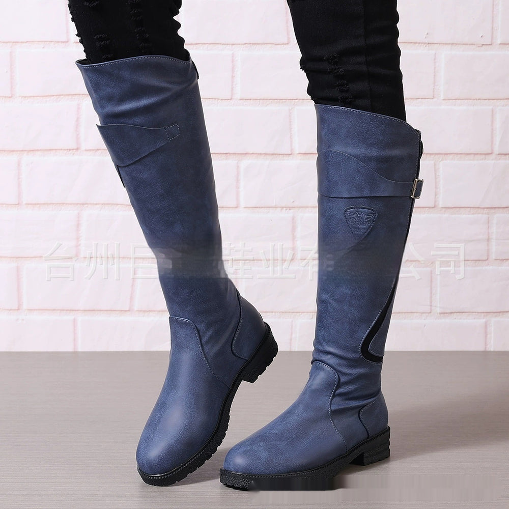 Blue knee-high boots on a light background