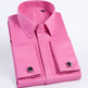 Folded pink dress shirt with cufflinks on a light gray background