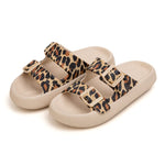 Beige sandals with leopard print straps on a white background