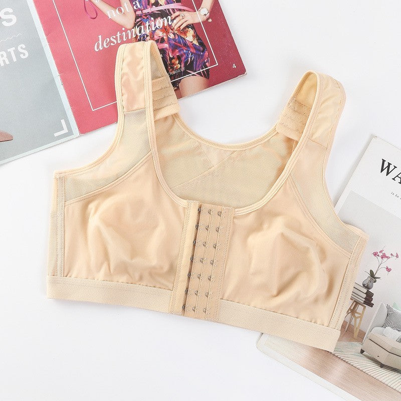 Beige compression garment on a white surface with magazines in the background