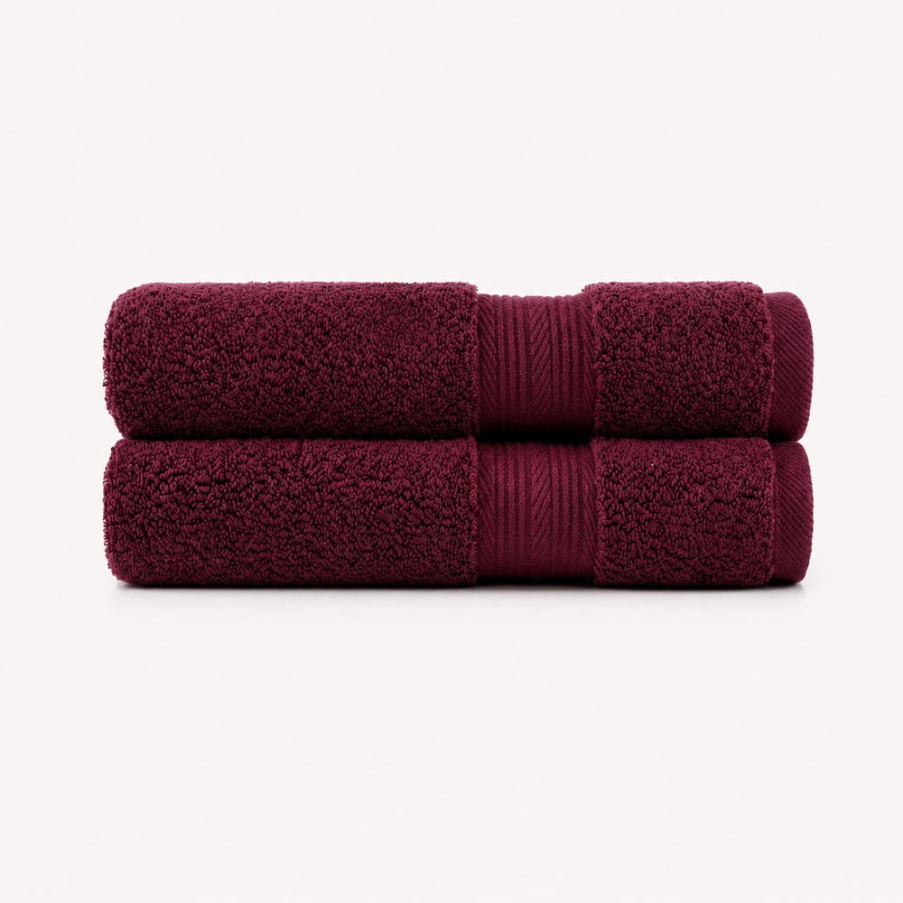 Two folded bath towels in a deep burgundy color, stacked vertically on a clean, light off-white background. Pure Cotton Bath Towel Set – Burgundy & Turquoise (74x33cm to 170x95cm)