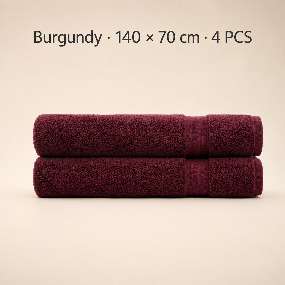 Two folded burgundy towels stacked horizontally on a light beige background, with text at the top reading 'Burgundy × 140 x 70 cm · 4 PCS'.