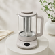 Automatic glass tea maker with stainless steel infuser on a premium neutral pedestal
